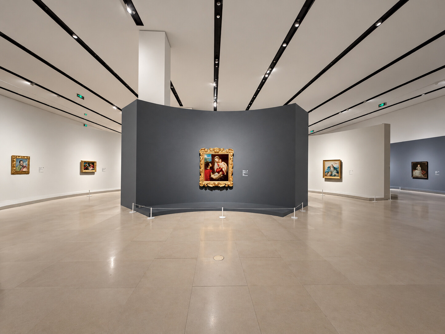 Installation view of The Realm of Masters, showing a spacious gallery with European paintings on white and dark gray walls, including a gilded-framed religious painting at the center.